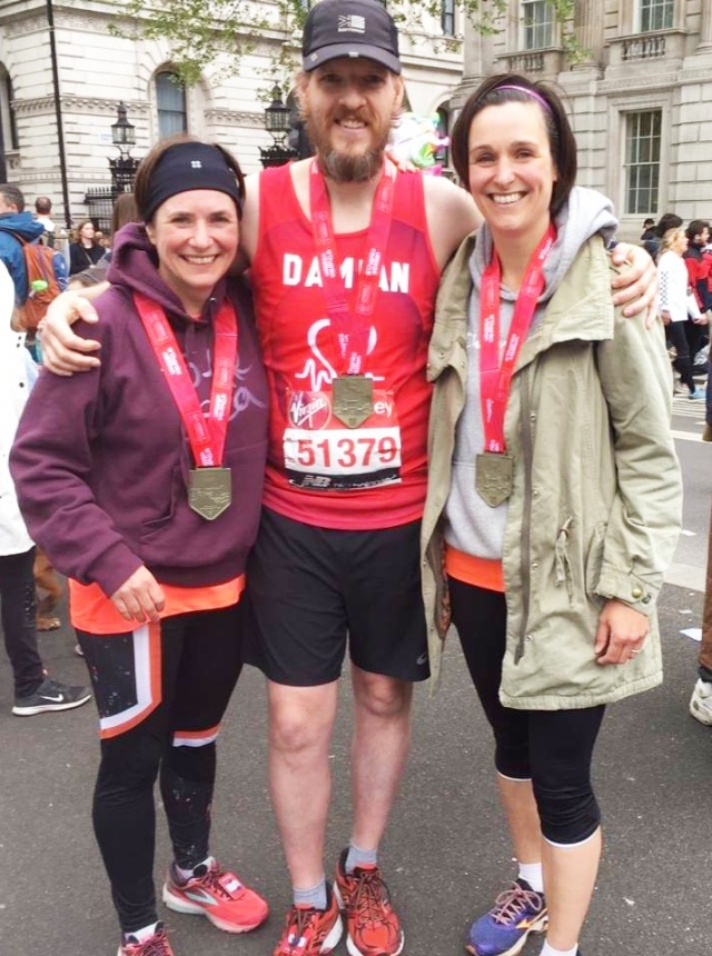 Damian Ashton, with his medal (and two 'marathon cousins') after completing the 2019 London Marathon
